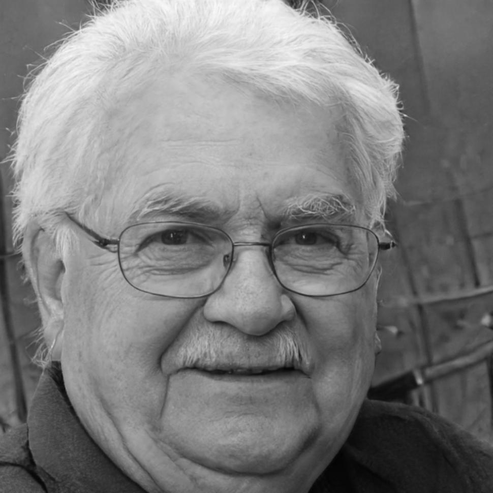 Professional headshot of blockchain finance instructor with traditional banking and DeFi experience