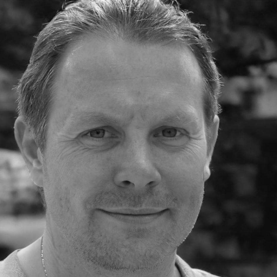 Professional portrait of senior blockchain consultant specializing in financial regulatory compliance